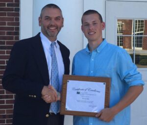 Mattituck junior senior high school scholarship recipient and Partner Martin Finnegan