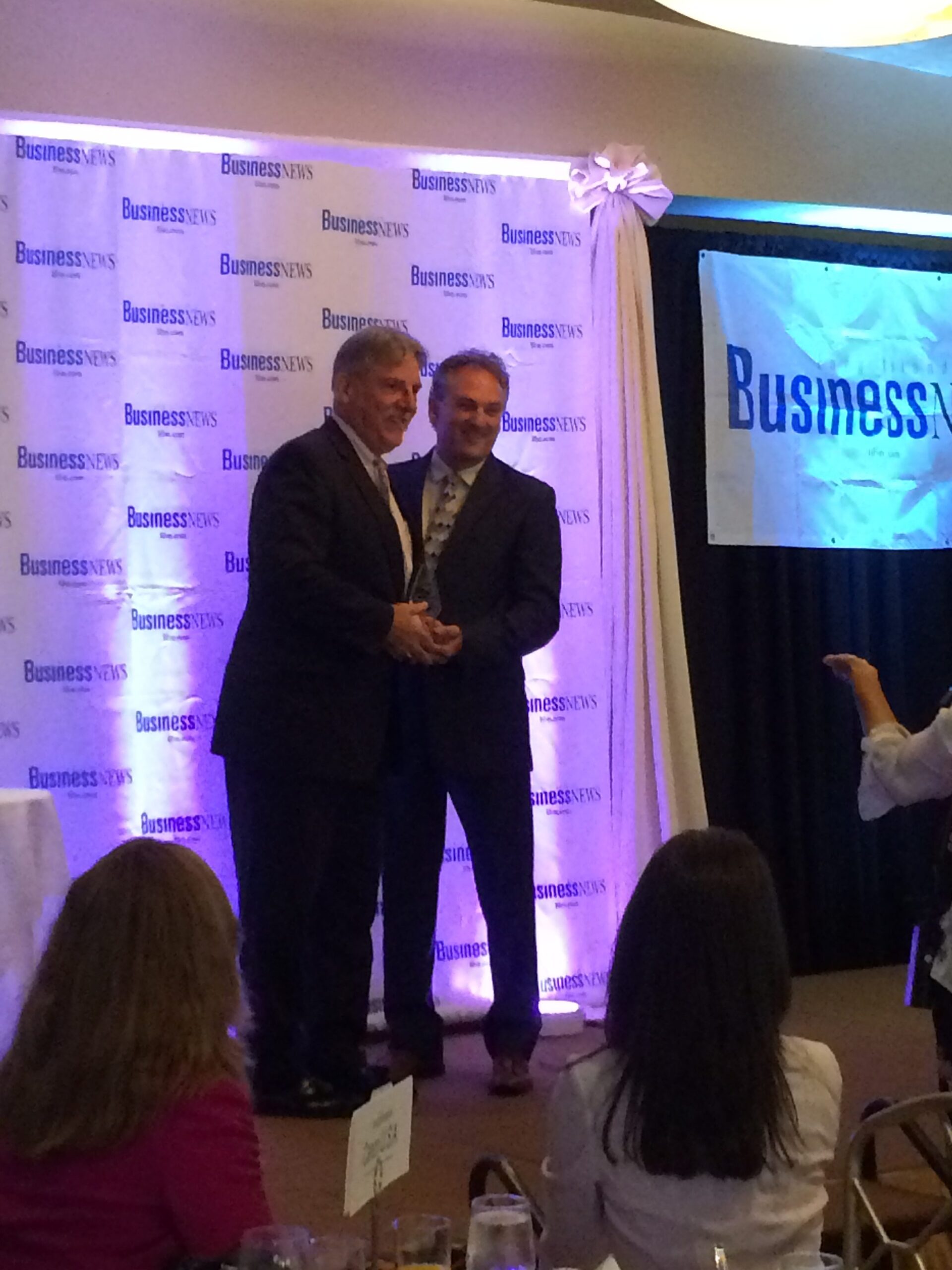 Christopher Kelley accepting leadership excellence award